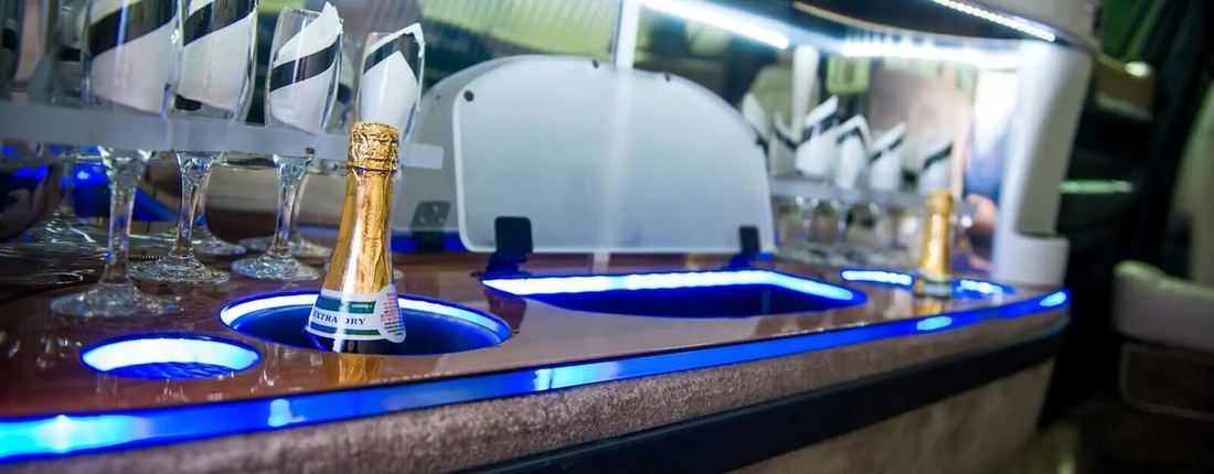 Champagne bar and lighting inside a stretch limousine