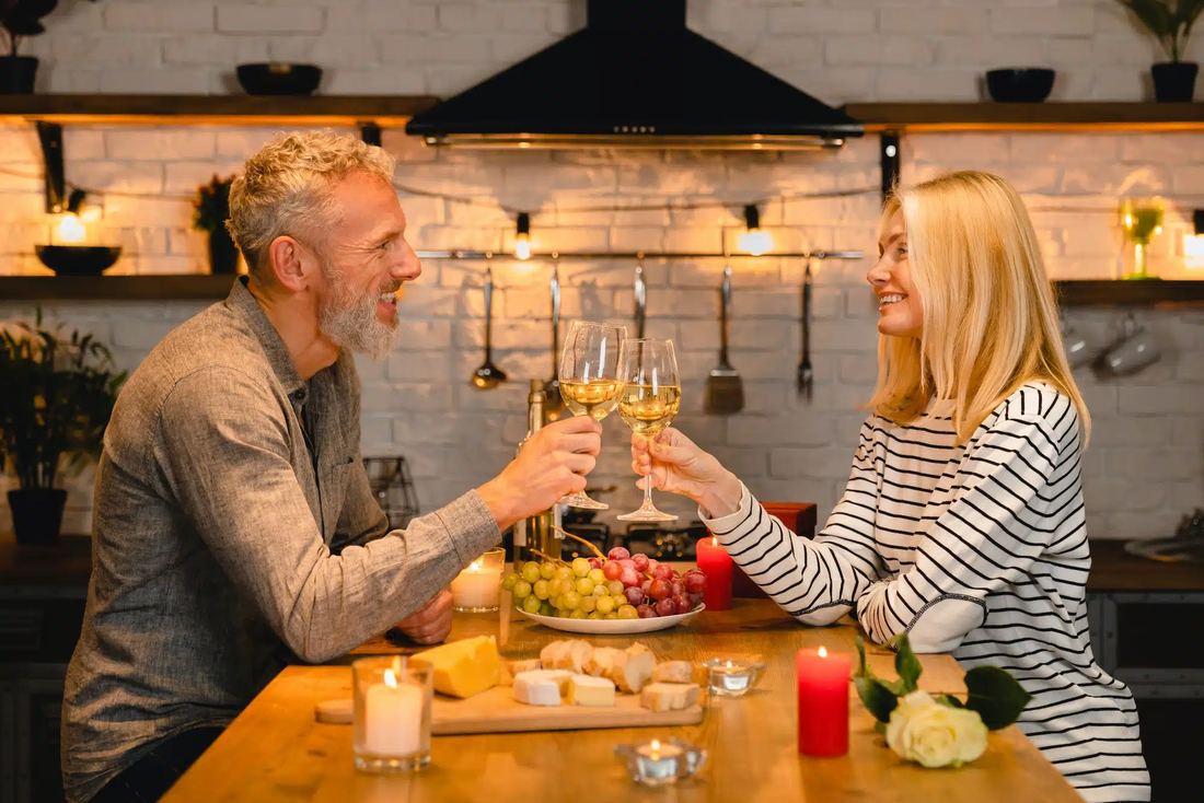 Couple toasting at dinner on an anniversary night